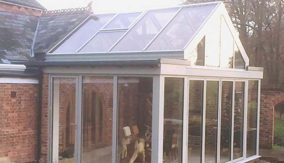 Conservatory extension to converted stable block in an Area of Outstanding Natural Beauty – Four Elms